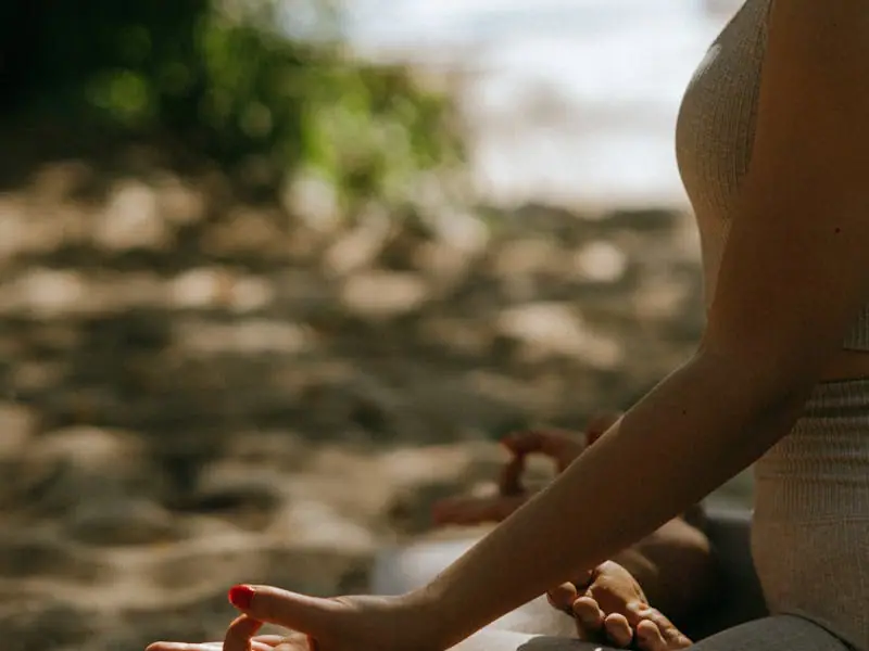 A person seated in quiet meditation