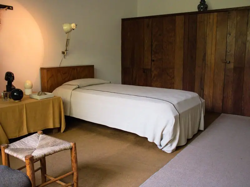 A warm-toned room with wood accents and natural textiles