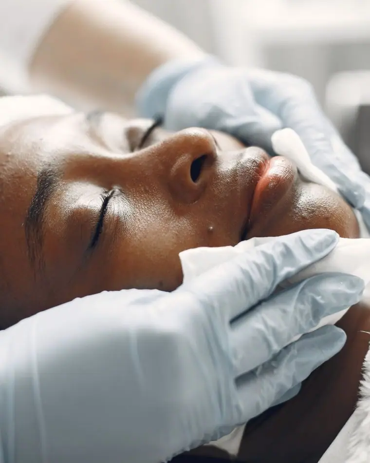 A guest receiving a calming facial